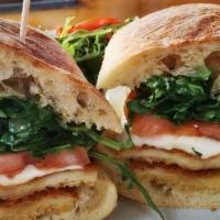 Chicken Milanese Sandwich · Panko crusted chicken, arugula, plum tomatoes, red onions and fresh Mozzarella on ciabatta. ...
