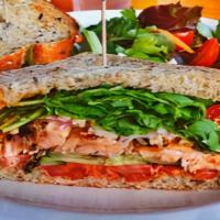Grilled Atlantic Salmon Sandwich · Red onion. Tomato, arugula and cucumber with chipotle mayo on multigrain toast. Served with ...