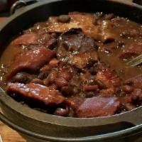Satuday- Feijoada · Black beans stew made with dried beef, pork, bacon, Sausage, and ribs served with collard gr...