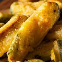 Zucchini Sticks · Zucchini sticks dipped in an egg mixture with bread crumbs, parmesan cheese, baking powder, ...