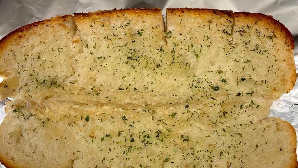 Garlic Bread Hero · Lightly Toasted Hero Bread coated with Olive Oil infused with Garlic, Parsley, and Parmesan