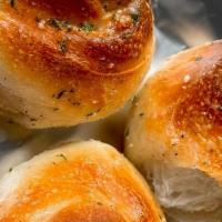 3 Garlic Knots · Knots of Pizza Dough coated with Olive Oil infused with Garlic, Parsley, and Parmesan