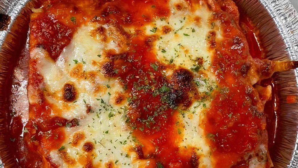 Lasagna · Layers of Lasagna-Pasta, Ground Beef, and Ricotta Baked in Marinara Sauce & Topped with Mozzarella Cheese