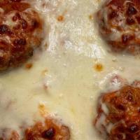 Meatball Parmigiana W Pasta · 2 House-Made Meatballs Split in Half and Baked in Marinara Sauce & Topped with Mozzarella Ch...