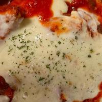 Chicken Parmigiana (No Pasta) · Breaded Chicken Cutlets Baked in Marinara Sauce & Topped with Mozzarella Cheese and Parsley