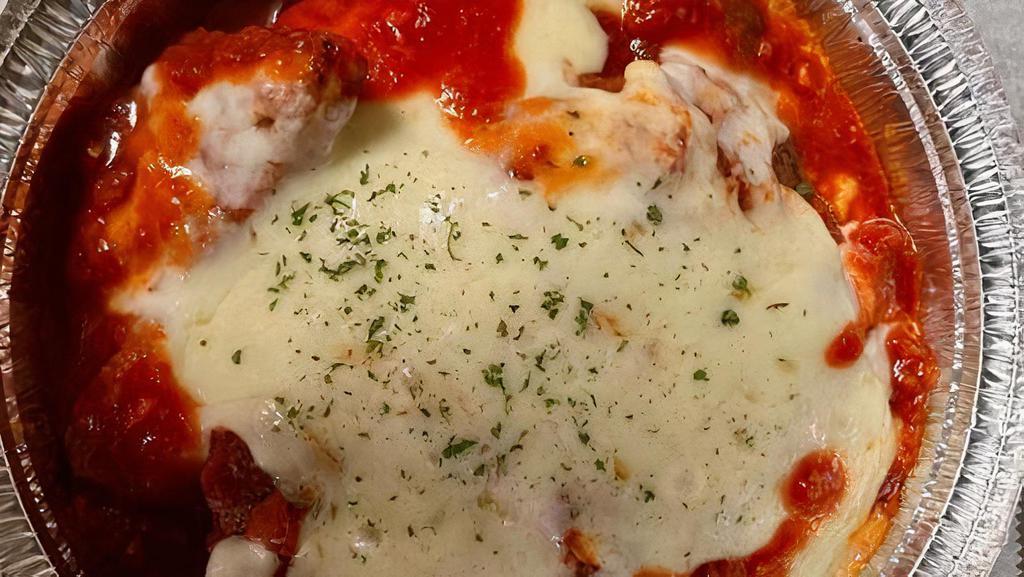 Chicken Parmigiana (No Pasta) · Breaded Chicken Cutlets Baked in Marinara Sauce & Topped with Mozzarella Cheese and Parsley