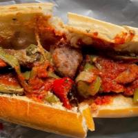 Sausage Peppers Hero · Italian Sausage and Roasted Bell Peppers Baked in Marinara Sauce and Served on a Toasted Hero.