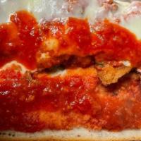 Veal Parmigiana Hero · Pieces of Fried, Breaded Veal Baked with Marinara Sauce & Mozzarella Cheese and Served on a ...