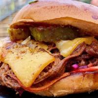 Smoked Brisket Burger + Fries · Overnight smoked brisket (lean flat) piled with Applewood smoked bacon, crispy fried onions,...