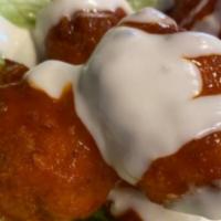 Buffalo Cauliflower Taco · Fried Cauliflower tossed in buffalo sauce and drizzled with blue cheese. served on a fresh l...