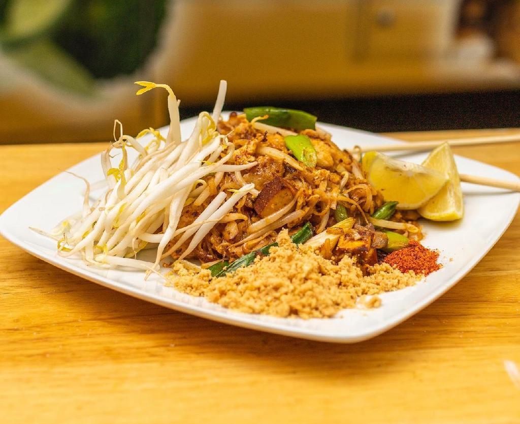 Pad Thai.. · Stir-fried thin rice noodles, egg, garlic, tofu, sweet radish, stir in a tamarind sauce topped with fresh bean sprouts, & limes, peanuts.