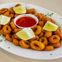 Calamari & Fritti · Golden fried calamari, served with choice of marinara sauce or lemon.