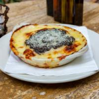 Lasagna Quattro Formaggi · Homemade pasta layered with bechamel, fontina, mozzarella and parmigiano cheeses.