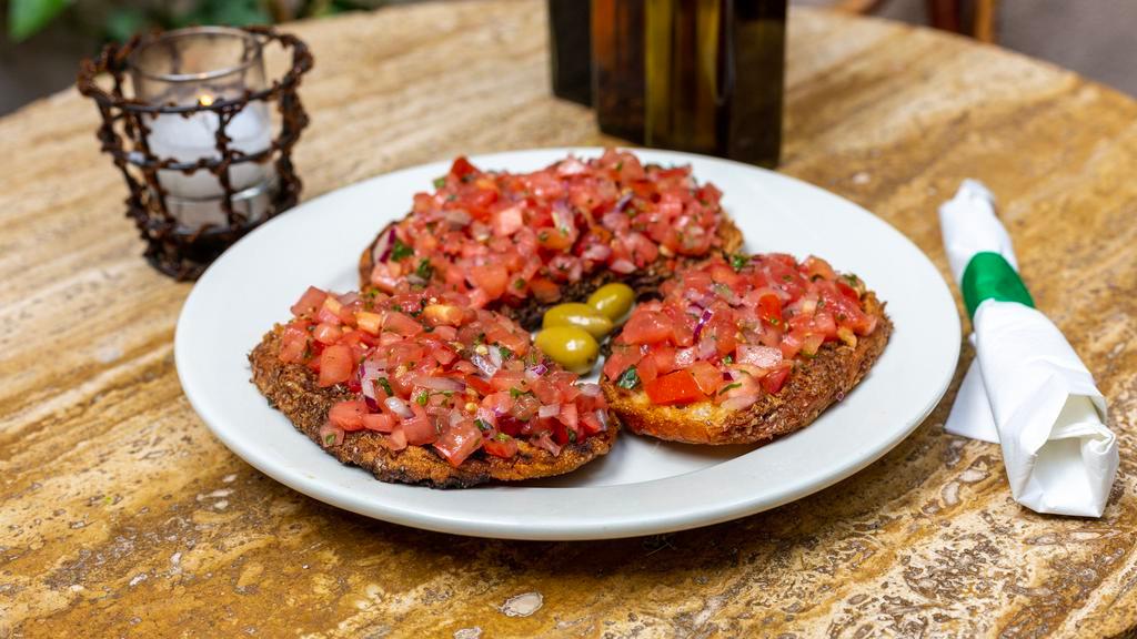 Bruschetta Pomodoro E Basilico · Grilled peasant bread, topped with tomato, basil, red onions and extra virgin olive oil.