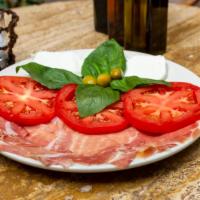 Caprese · Imported Italian buffalo mozzarella with tomato, basil and extra virgin olive oil.
