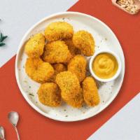 Chicken Nuggets 12 Pcs · Bite sized nuggets of chicken breaded and fried until golden brown. Served with your choice ...