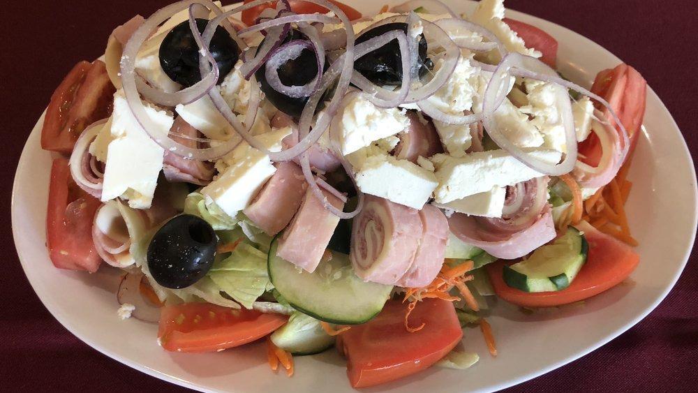 Greek Salad · Feta cheese, ham, salami, Provolone cheese.