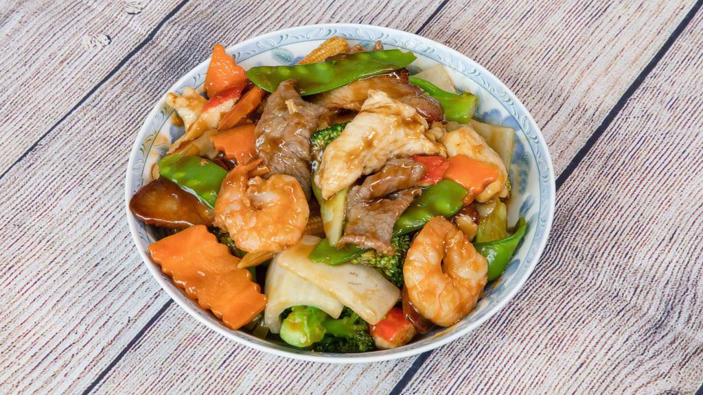 Happy Family · Jumbo shrimp, beef, chicken, pork, straw mushrooms, baby corn, snow peas, bamboo shoots, water chestnuts and broccoli in house special sauce.