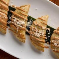 Black Bean And Cheese Empanadas · Chihuahua cheese and queso fresco, avocado leaf, pasilla Oaxaca chile. Four per order. . Veg...