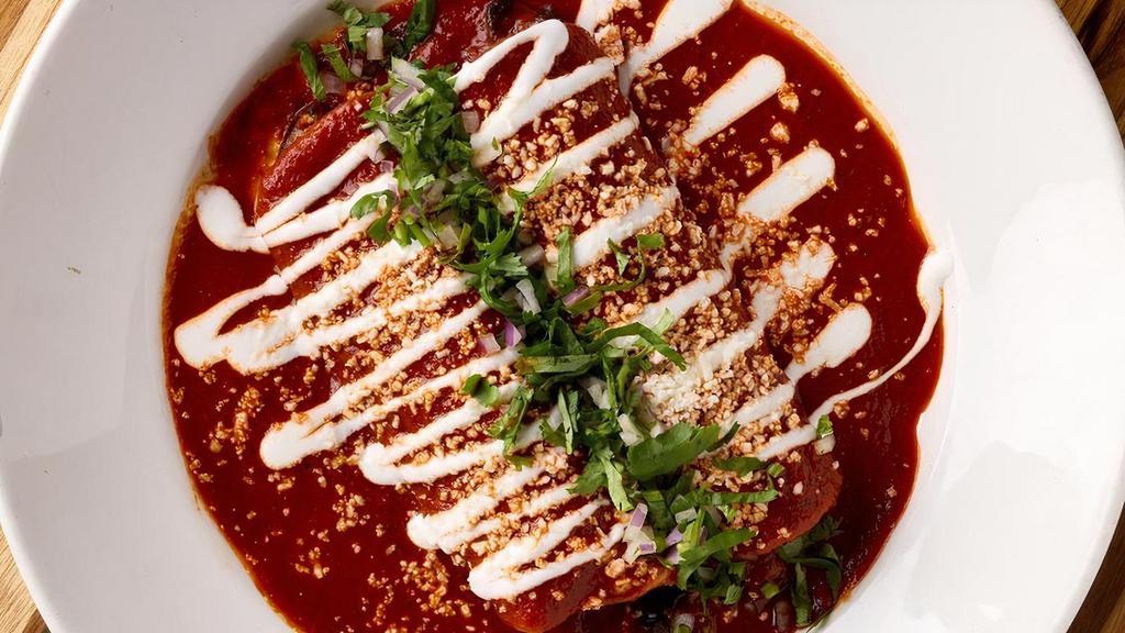 Enchiladas - Chihuahua Cheese_ · Filled with Chihuahua cheese. Choice of mole poblano, salsa verde or classic red guajillo chile sauce. Two per order served with rice. . Vegetarian
