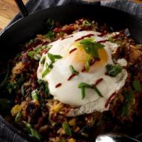 $ Mexican Fried Rice · Chorizo, fried egg, bacon, corn, black beans, scallion, cilantro, tomato, chiles torreados