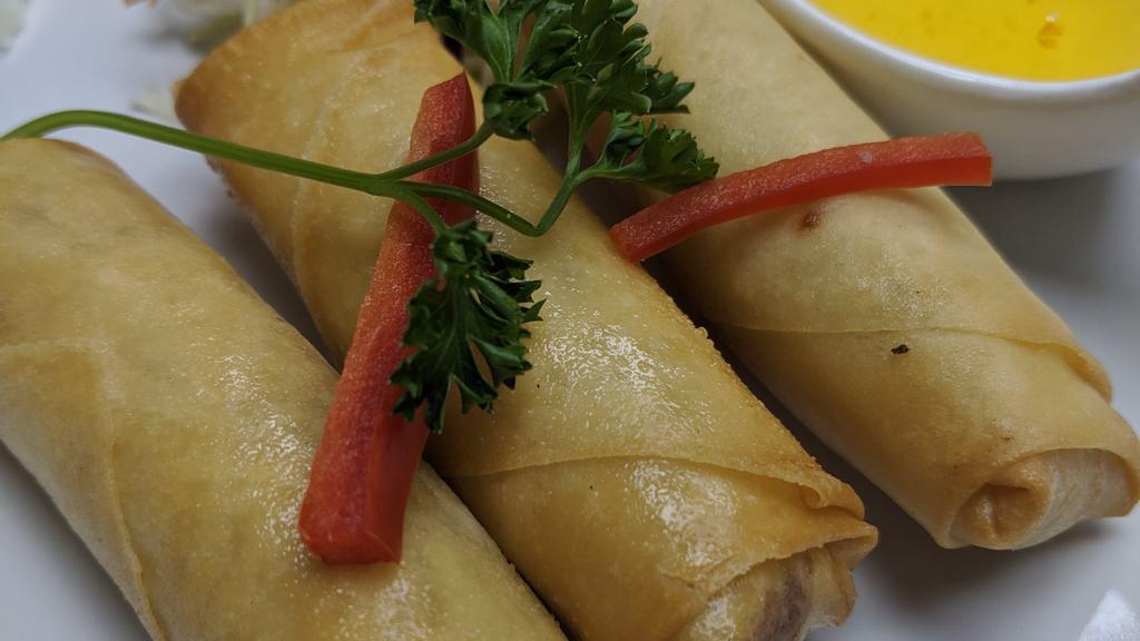 Crispy Spring Roll · Crispy vegetable spring rolls with cabbage, carrot, taro root glass noodles served with plum sauce.