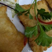 Curry Puffs · Fried puff pastry stuffed with minced chicken, potato, caramelized onion, carrot, and yellow...