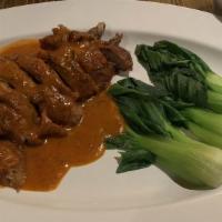 Duck Chu Chee · Hot and spicy. Crispy fried roasted duck served with homemade Chu chee curry sauce, coconut ...