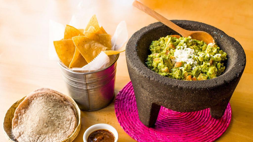 Guacamole · Vegetarian, vegan, gluten-free. Guacamole made to order, served with hand-pressed tortillas, chips, and pasilla de Oaxaca salsa. Serves two people.