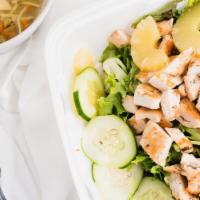 Asian Chicken Salad · Grilled Chicken, lettuce, cucumbers, tomatoes and pineapple, tossed in a sesame ginger vinai...