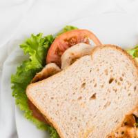 Grilled Chicken Sandwich · With mozzarella and tomato on focaccia bread.