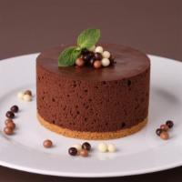 Chocolate Mousse Cake · Fudgy chocolate cake base topped with velvety smooth, airy, chocolate mousse.