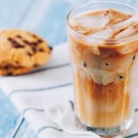 Iced Latte · Deep, dark espresso shots with steamed milk over ice.