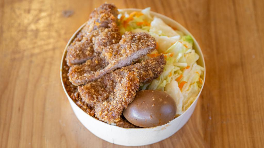 Golden Crust Pork Chop Bento Box 黃金厚切豬排便當
 · Served with sauteed cabbage, braised egg and our signature braised minced pork(contain PEANUTS) over sushi-grade rice.