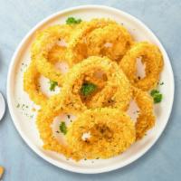 Ring Ding Onion Rings · (Vegetarian) Sliced onions dipped in a light batter and fried until crispy and golden brown.