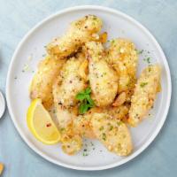 The Great Garlic Wings · Fresh chicken wings breaded, fried until golden brown, and tossed in garlic. Served with a s...