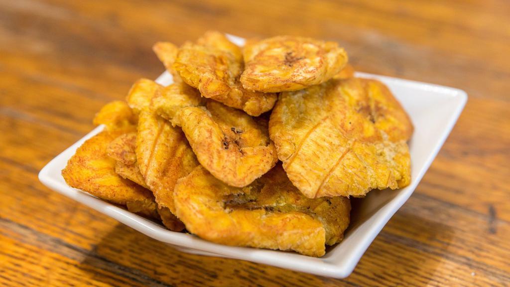 Tostones · Fried green plantains.