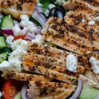 Grilled Chicken Salad · Chicken, Lettuce, Onions, Blue Cheese, Cucumber olives & Dressing.