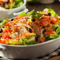 Mexican Fiesta Salad · Chipotle chicken, jalapeno, black beans, shredded cheese, corn and onions tossed with mixed ...