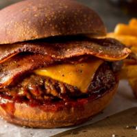 Bacon Cheeseburger Deluxe · Juicy all beef patty, crispy bacon, fresh lettuce, tomato, ketchup and melted cheese served ...