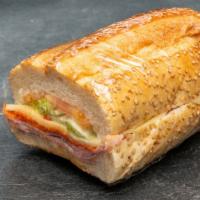 Italian Combo Sandwich · Genoa salami, pepperoni, provolone cheese, lettuce, tomato, Bermuda onion, red peppers, and ...