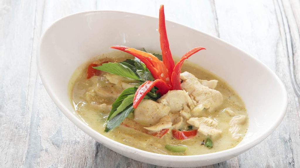 Green Curry (L) · Gluten free, hot. Spices and herbs blended in hot green chili paste with bamboo shoots, green beans, eggplants, basil, peas and peppers, simmered in coconut milk.