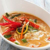 Panang Curry (L) · Hot, gluten free. Spices and herbs blended in chili paste with string beans, peppers, potato...