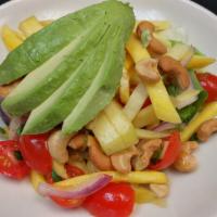 Mango Avocado Salad · Vegetarian and gluten-free. Spicy. Mixed green vegetables, mango, avocado, red onion, tomato...