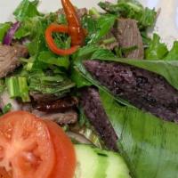 Nam Tok Thai-Style Steak Salad · Gluten-free. Spicy. Grilled sliced top sirloin, chili powder, roasted rice powder, red onion...