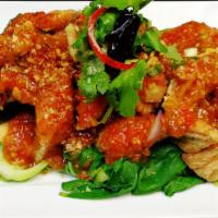 Pla Saam Ross · Deep fried filleted branzino with sweet and spicy tamarind sauce served with steamed vegetab...
