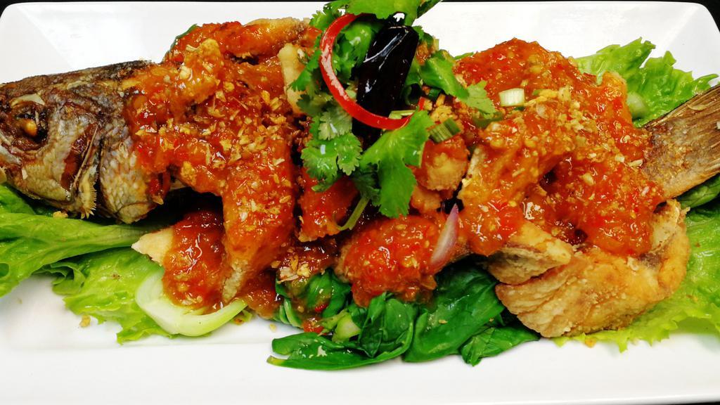 Pla Saam Ross · Deep fried filleted branzino with sweet and spicy tamarind sauce served with steamed vegetables. Spicy.