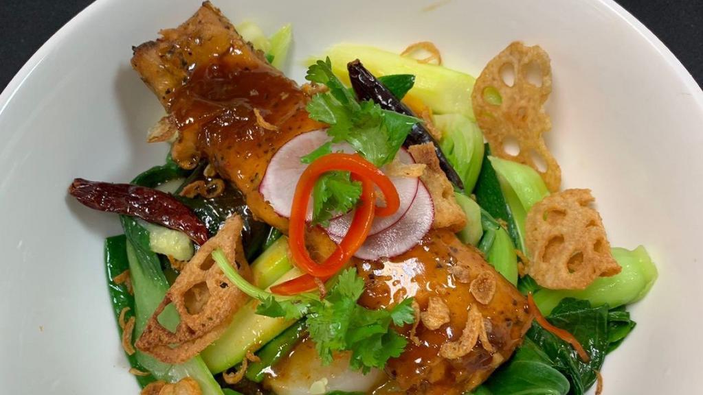 Salmon Tamarind · Grilled fillet of salmon, bok choy, asparagus, zucchini, pumpkin topped with fried shallots.