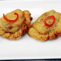 Curry Puffs · Fried puff pastry stuffed with minced chicken, potato, caramelized onion, carrot and yellow ...
