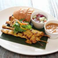 Chicken Satay · Grilled marinated chicken on skewers served with peanut sauce and cucumber relish.